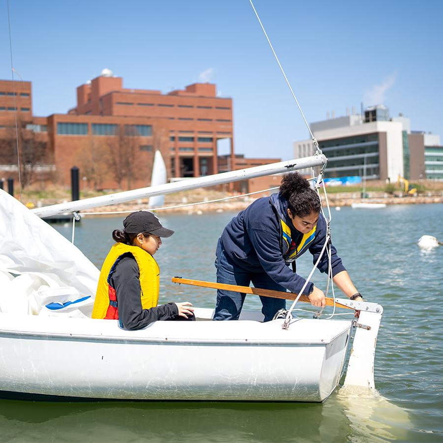 Two students in sailboat Savin Hill Cove.